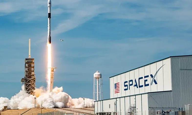 A SpaceX Falcon 9 lifting off from the launch pad